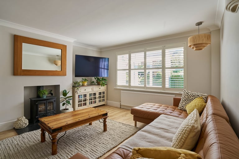 Interior shot of house showing decor of lounge with furniture and soft furnishings